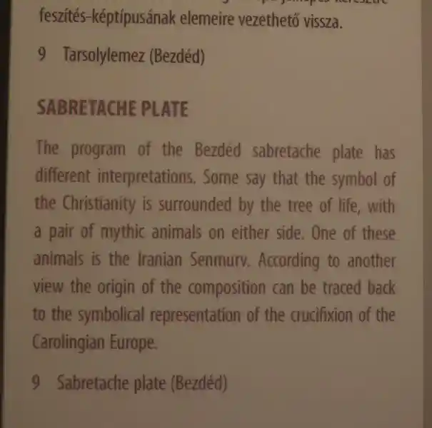 Cross engraved on a gold plate